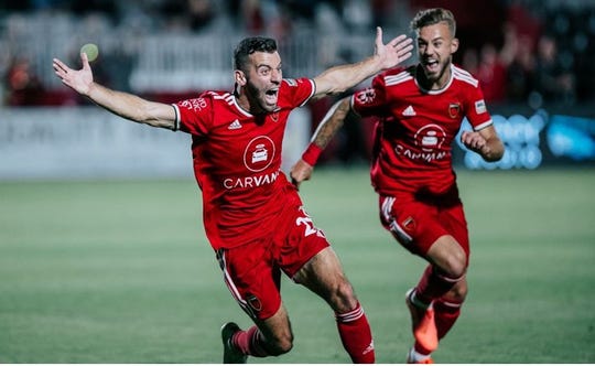Phoenix Rising FC's Joey Calistri (left) celebrates the game-tying goal against SD Loyal Saturday at Wild Horse Pass stadium on June 5, 2021.