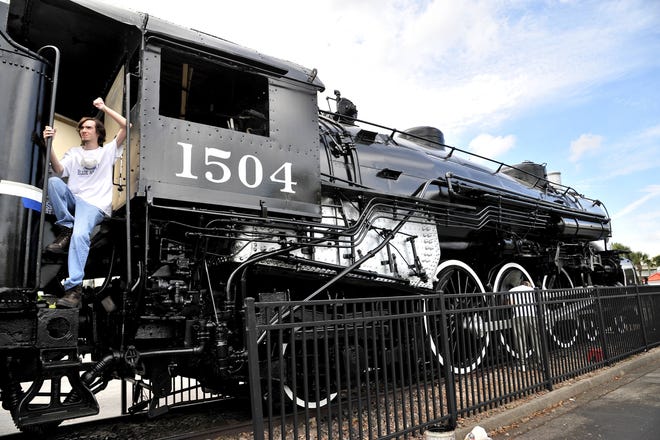 Joey Gannon takes a break during the 2015 restoration of the exterior of Atlantic Coast Line locomotive 1504 at the Prime Osborn Convention Center. The cosmetic restoration of the 1919 USRA light Pacific (4-6-2) steam locomotive was done by the North Florida Chapter of the National Railway Historical Society.