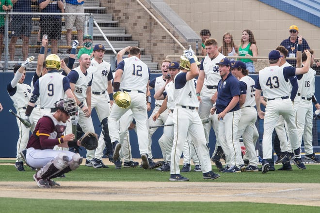 Notre Dame infielder Niko Kavadas (12) is congratulated by his teammates after hitting home run during a 14-2 victory over Central Michigan Sunday, June 6, 2021, at Frank Eck Stadium in South Bend. The Irish advance to the NCAA Super Regional round