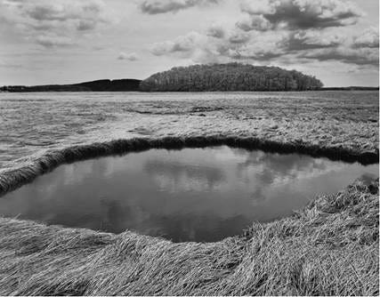 “Salt Marsh Island, Clouds Ipswich, MA” by Dorothy Kerper Monnelly.
