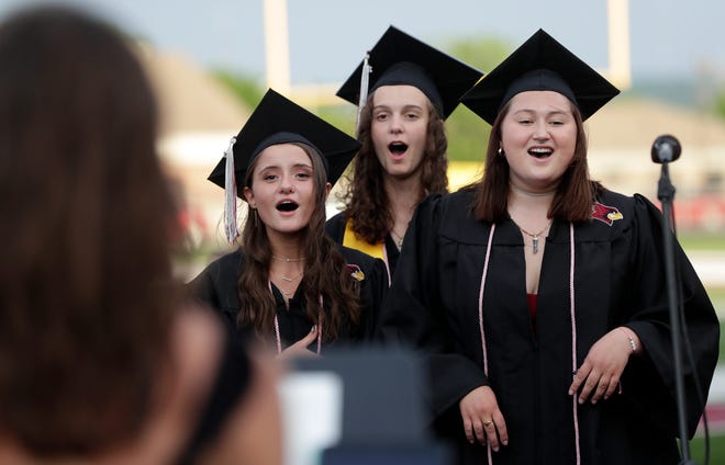 Senior choir members perform during the De Pere High School graduation ceremony on June 7, 2021. The De Pere School Board voted to make masks recommended but optional for students and staff in grades seven and higher to start the 2021-2022 school year.