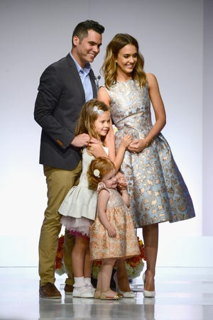 Jessica Alba and Cash Warren with their daughters Honor and Haven at The Helping Hand of Los Angeles Mother's Day Luncheon at The Beverly Hilton Hotel on May 9, 2014.