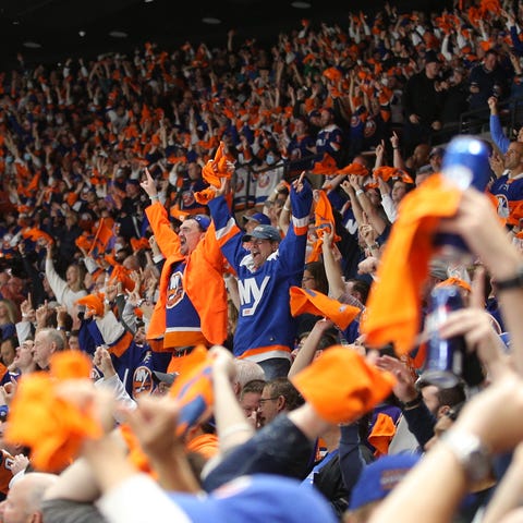 Fans celebrate a goal by New York Islanders center