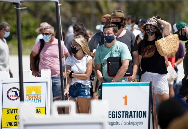 People line up to receive a Johnson & Johnson vaccine in Miami Beach on May 2, 2021.