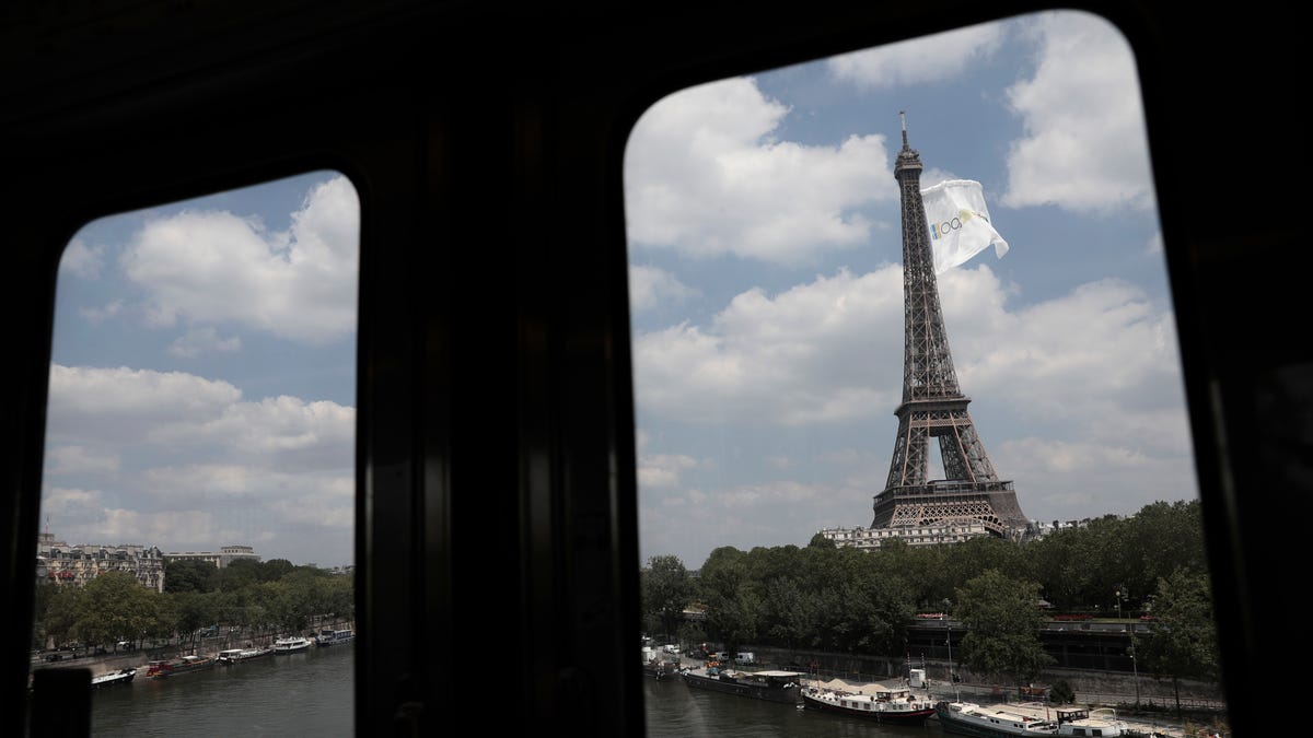 June 8, 2021:   Pictured from the elevated subway train, a giant flag flies at the Eiffel Tower in Paris. The reason of the event was not immediately known.