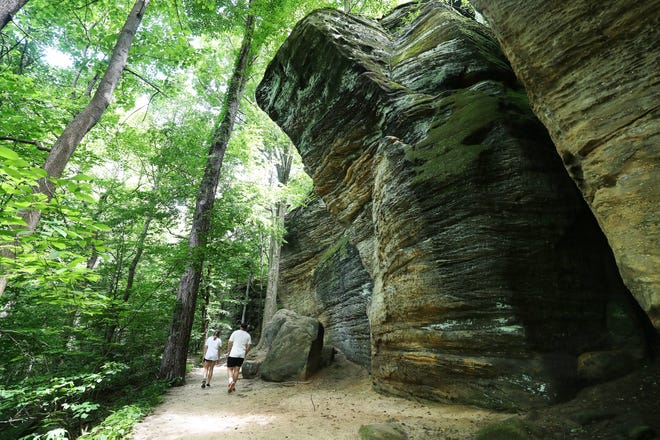 A couple walks along the Ledges Trail in Cuyahoga Valley National Park on June 9.