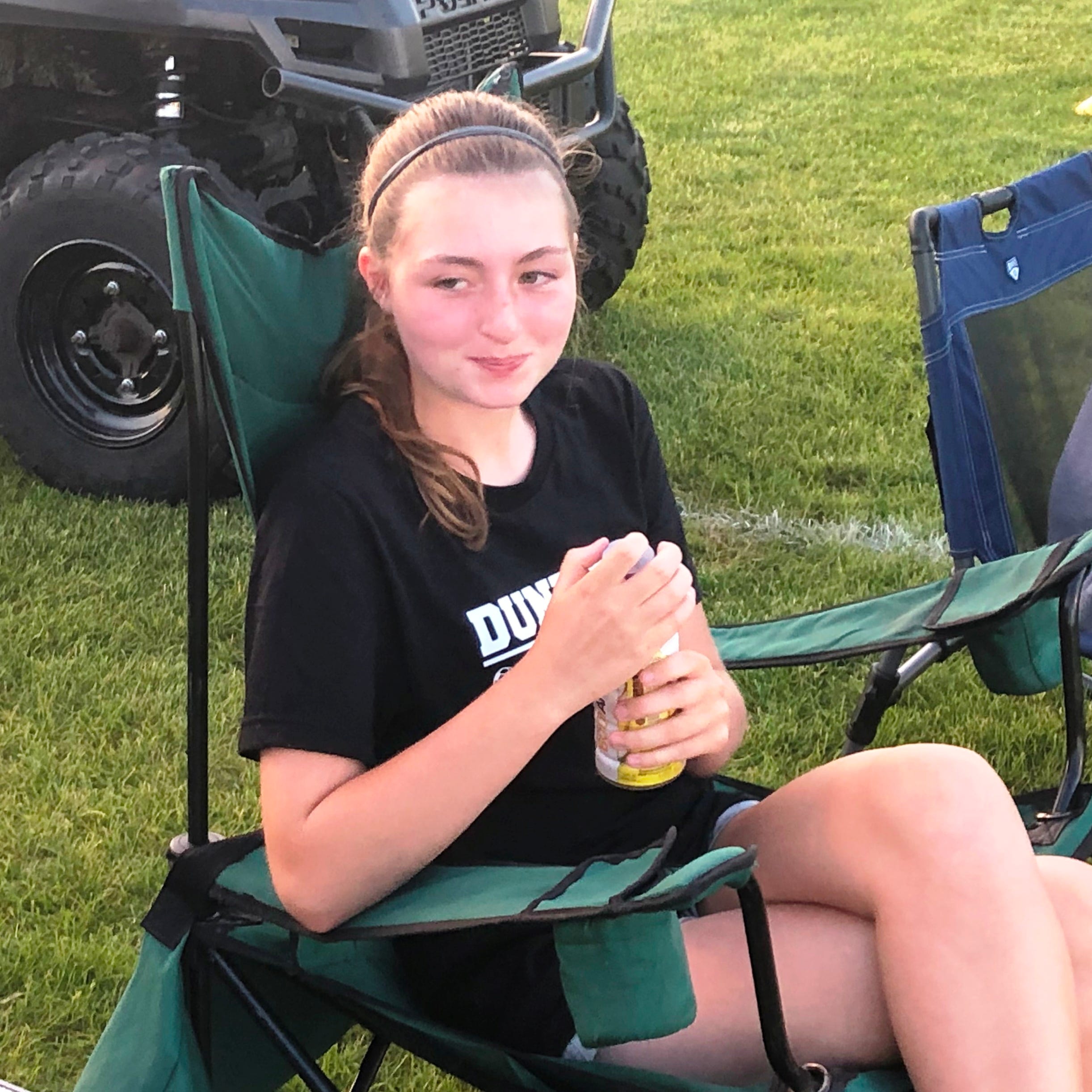 Tessa Sutton, 15, watches her Dunlap High School soccer teammates play a sectional semifinal match against Washington on Tuesday, June 8, 2021.