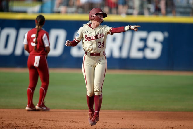 Florida State's Sydney Sherrill (24) celebrates as she rounds the bases on Elizabeth Mason's two-run home run in the first inning of Game 2 of the Women's College World Series championship series at USA Softball Hall of Fame Stadium on June 9, 2021.