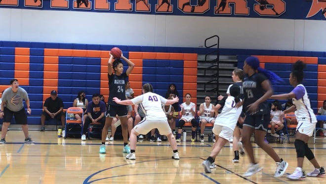 June 5, 2021; Perry's Khamil Pierre holds the ball on offense at the left side of the perimeter against Mesa in the Lady Extravaganza girls basketball tournament in Westwood High School in Mesa, Ariz.