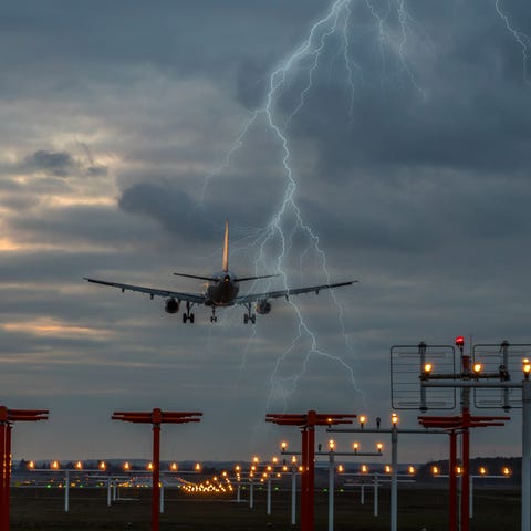 Thunderstorm on landing airplane at the airport