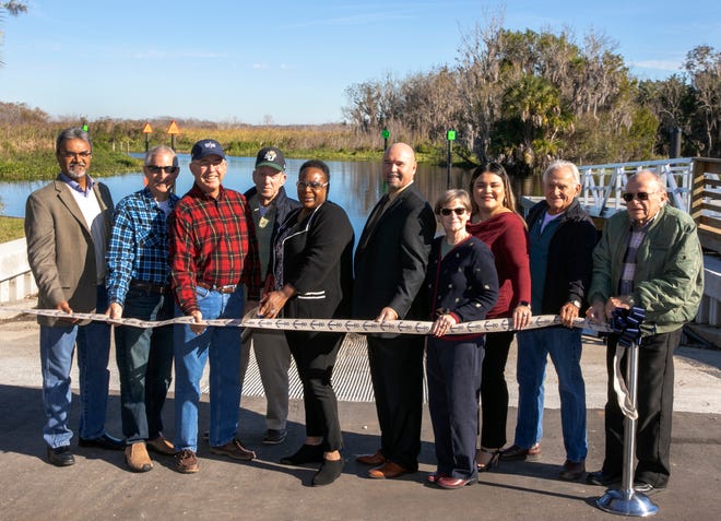 From left, design engineer Shailesh Patel, land donors Peter Glover and Kevin O’Dwyer, Pierson Town Council Member James Peterson, Volusia County Council Member Barbara Girtman, Parks Director Tim Baylie, Rita Broadway and Roxy Cruz of the Astor Chamber of Commerce, and Town Council Members Herbert Bennett and Tom Larrivee at the opening of Shell Harbor Park in December 2019.