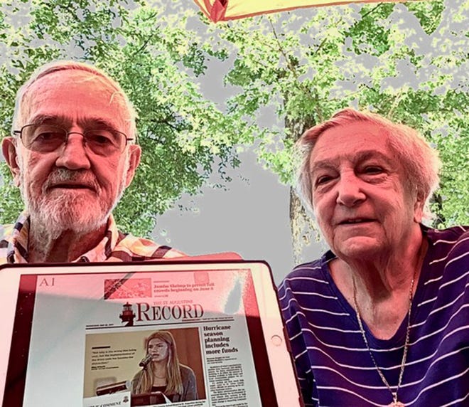 Lee and Joan Martin read The Record online while waiting for dinner at the Ale House in Grand Junction, Colorado.