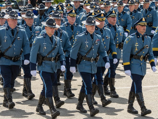 The union representing Massachusetts State Troopers said dozens of the troopers are planning to quit their jobs after Gov. Charlie Baker mandated that they must receive COVID-19 vaccines.