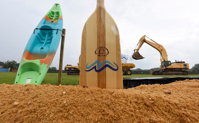 Boat paddles to be used for shovels during the groundbreaking ceremony for the whitewater park and outdoor fun center in Montgomery, Ala., on Thursday June 10, 2021.