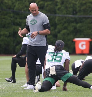 Head coach Robert Saleh with Josh Adams while the team warms up as the New York Jets participate in OTA’s at their practice facility in Florham Park, NJ on June 10, 2021.