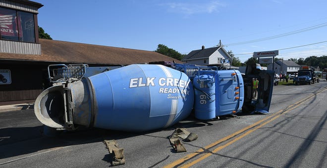 A concrete truck crashed and fell on its side, in the afternoon on June 10 while attempting to swerve to miss a vehicle that pulled in front of it in the 3300 block of West Lake Road in Millcreek Township. Millcreek police said a BMW heading southbound on Marshall Ave. crossed in front of the truck, which was headed east on West Lake Road. The truck swerved, but the vehicles collided. When the truck driver tried to correct after swerving, it fell over, coming to rest pointing west, shown here. Police said the driver of each vehicle was transported to UPMC Hamot.