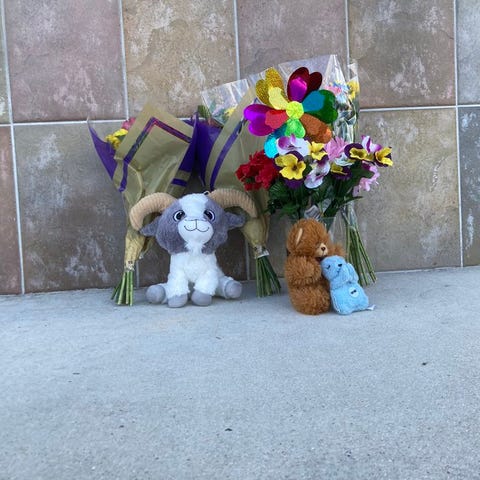A memorial display out the Publix at The Crossroad