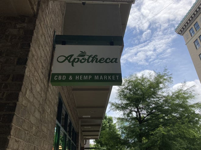 The sign in front of Apotheca, a chain of CBD dispensaries in Asheville and across the southeast.