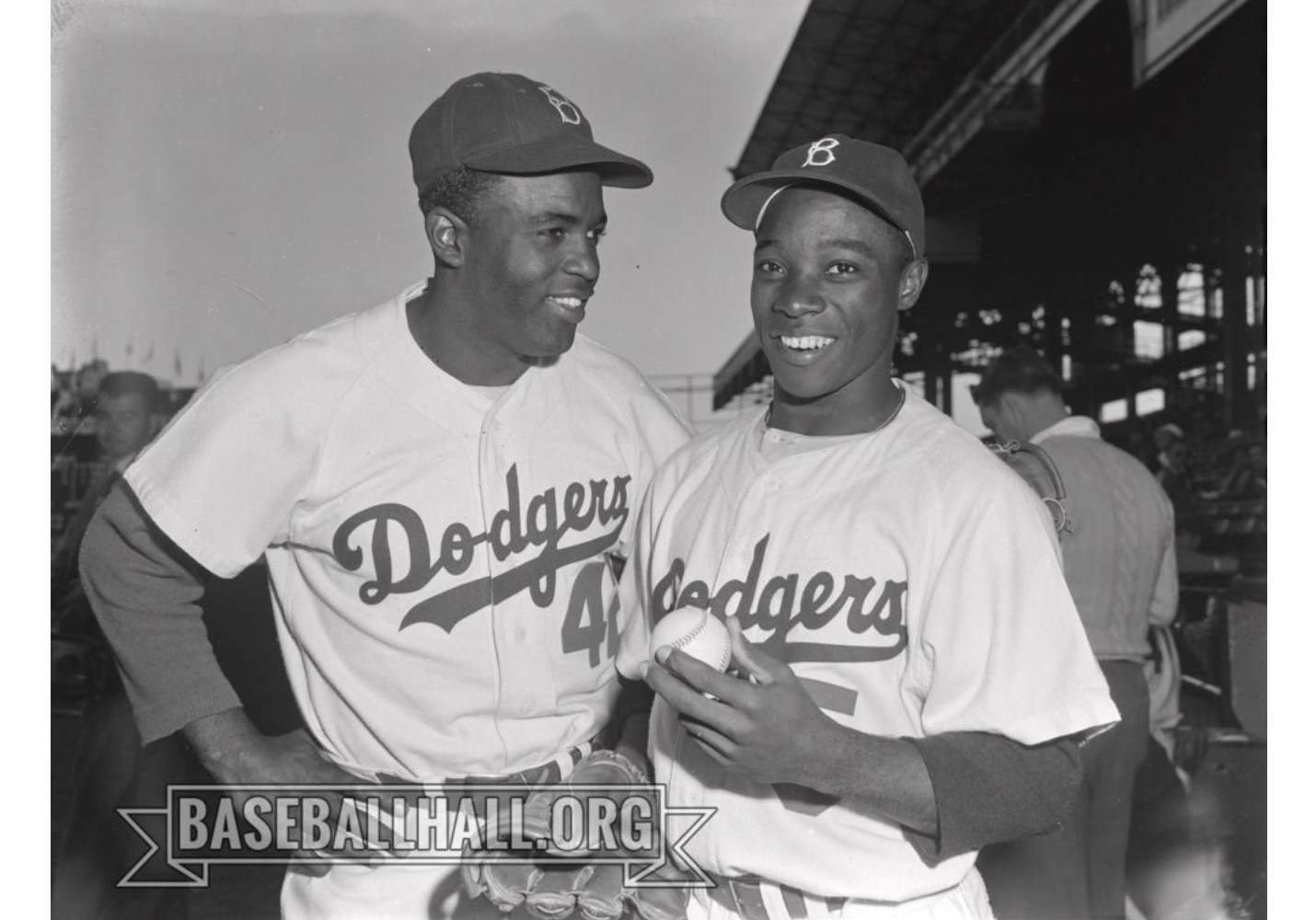 Jackie Robinson (left) and Sandy Amoros (right) posed together on the field at Ebbets Field, taken in 1952.