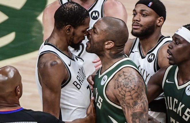 Second round: Bucks forward P.J. Tucker (17) yells in the face of Nets forward Kevin Durant (7) during the second half of Game 3.