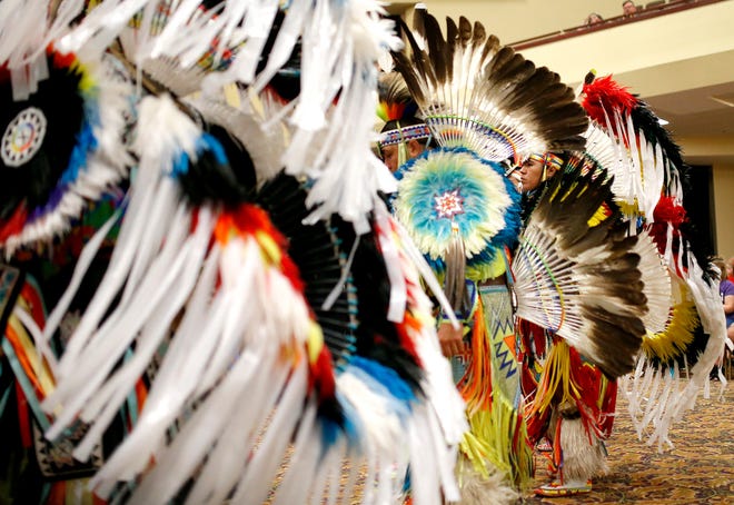 Dancers participate in the grand entry of dancers Saturday during the Red Earth Festival at Grand Casino & Hotel Resort in Shawnee.