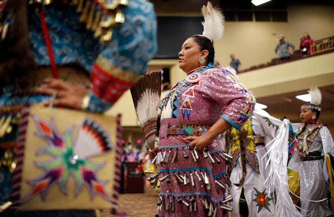 Dancers participate in the grand entry of dancers Saturday during the Red Earth Festival.