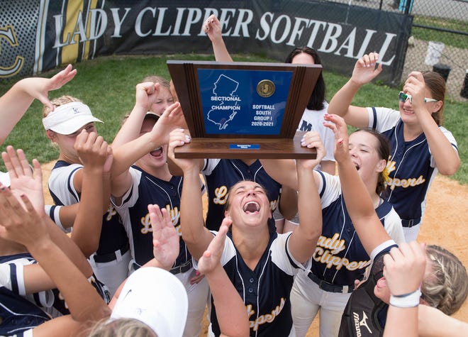 Members of the Clayton High School softball team celebrate with their championship trophy after Clayton defeated Gloucester, 3-0, in the South Jersey Group 1 softball final played at Clayton High School on Saturday, June 12, 2021.  