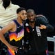 Phoenix Suns guard Chris Paul, right, talks with Suns guard Cameron Payne, left, during the first half of Game 2 of their NBA basketball first-round playoff series against the Los Angeles Lakers Tuesday, May 25, 2021, in Phoenix. (AP Photo/Ross D. Franklin)