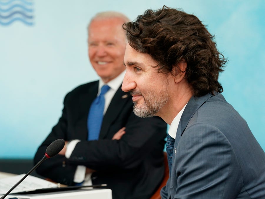 President Joe Biden (left) and Canadian Prime Minister Justin Trudeau attend the G-7 summit at the Carbis Bay Hotel in Cornwall, England, on Friday, June 11, 2021.