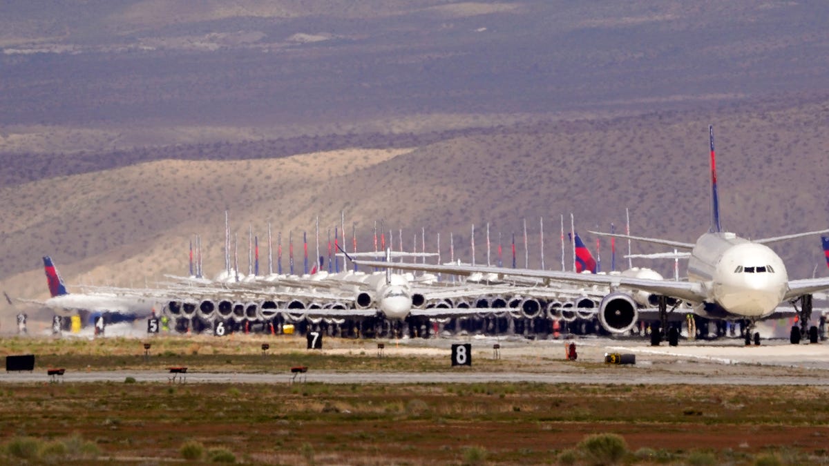 Delta Airlines aircraft are stored at Southern California Logistics Airport, Wednesday, March 25, 2020, in Victorville, Calif.