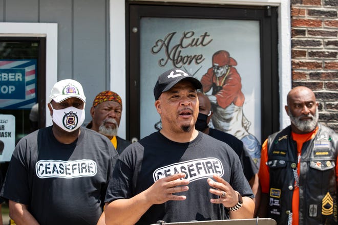 Al Edmondson speaks Sunday outside A Cut Above the Rest barber shop during a press conference calling for a ceasefire of gun violence on Juneteenth in Columbus.