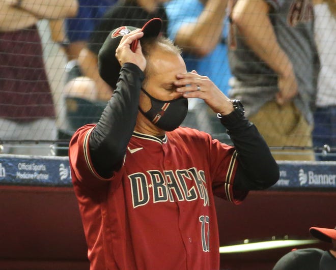 Arizona Diamondbacks manager Torey Lovullo (17) wipes his head during the seventh inning against the Los Angeles Angels in Phoenix June 13, 2021.