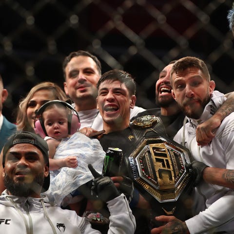 Brandon Moreno poses for photos following his cham