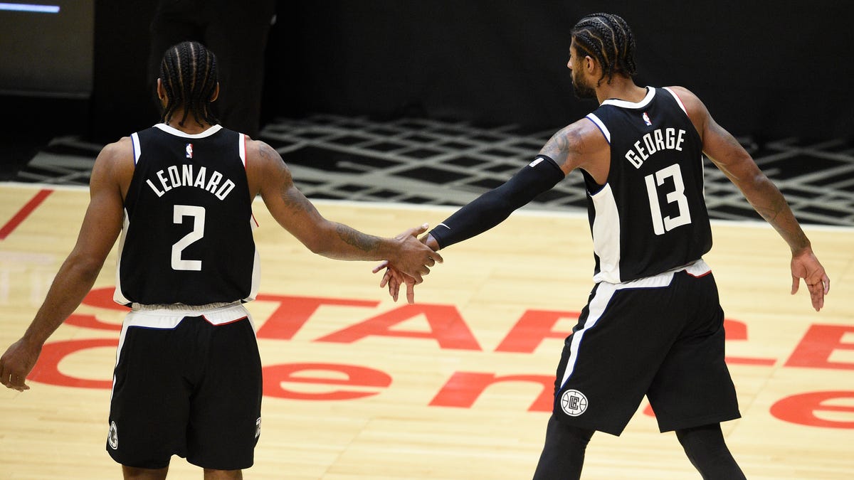 Kawhi Leonard and Paul George celebrate in the fourth quarter of the Clippers' Game 3 win over the Jazz.