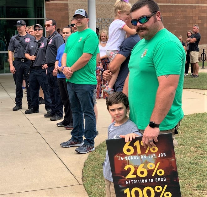 Spartanburg firefighters and their families showed up in force at Monday night's city council meeting to support a larger pay increase than proposed.