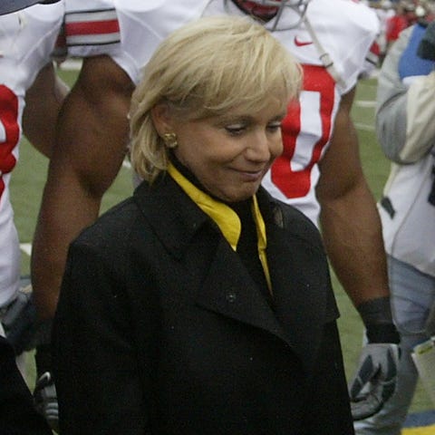 Cathy Schembechler participates in the opening coi