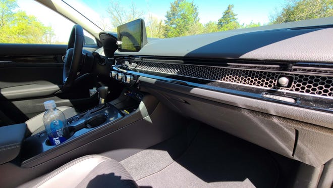 The 2022 Honda Civic's signature honeycomb dash trim hides HVAC vents for a clean, Tesla-like look.