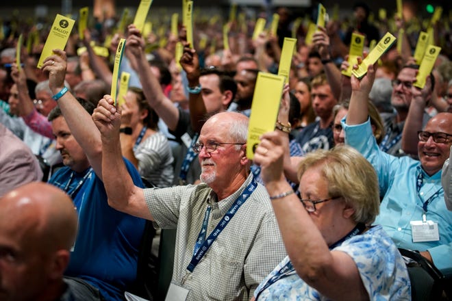 Southern Baptists vote on a resolution during the annual Southern Baptist Convention meeting at the Music City Center in Nashville, Tennessee on Tuesday, June 15, 2021.