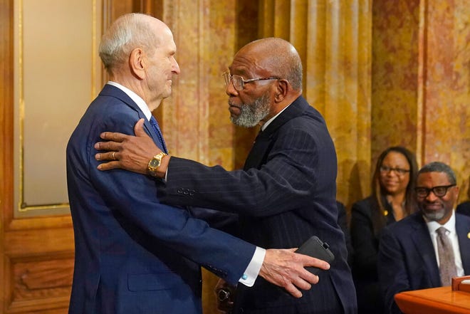 The Rev. Amos C. Brown, right, and President Russell M. Nelson of The Church of Jesus Christ of Latter-day Saints hug during a news conference Monday, June 14, 2021, in Salt Lake City. Top leaders from the NAACP and The Church of Jesus Christ of Latter-day Saints announced $9.25 million in new educational and humanitarian projects as they seek to build on an alliance formed in 2018. (AP Photo/Rick Bowmer)