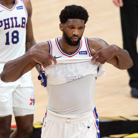 Joel Embiid and his 76ers teammates leave the cour