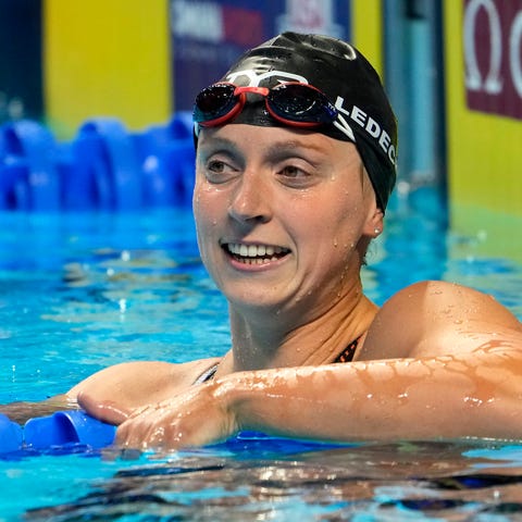 Katie Ledecky reacts after swimming in the women's