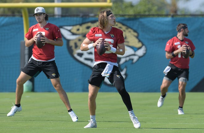 Jaguars quarterbacks (3) C.J. Beathard, (16) Trevor Lawrence and (15) Gardner Minshew II during drills at Tuesday's minicamp session. The Jacksonville Jaguars held their Tuesday morning session of the team's mandatory minicamp at the practice fields outside TIAA Bank Field, June 15, 2021. [Bob Self/Florida Times-Union]