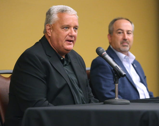 Doug Ute, left, Ohio High School Athletic Association executive director, speaks during a press conference at the Pro Football Hall of Fame in Canton on Wednesday, June 16, 2021. Shown at right is Steve Strawbridge, chief administrative officer at the Pro Football Hall of Fame.