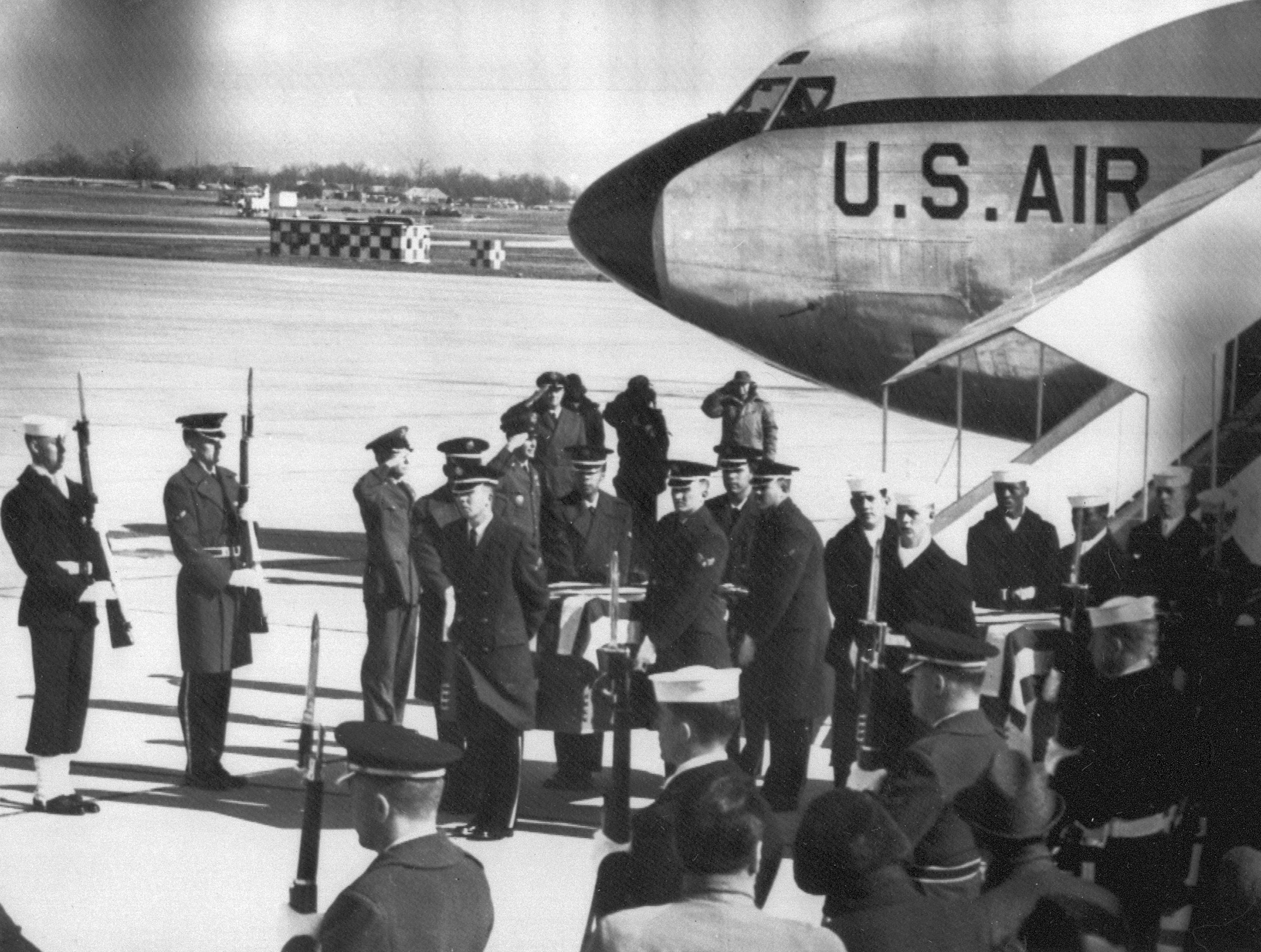 A honor guard greets the coffins of US astronauts Virgil I. Grissom, Edward H. White II, and Roger B. Chaffee, at Saint-Andrews air force base, 31 January 1967. All three astronauts died when the Apollo command module was destroyed by fire during a training exercise 27 January 1967. It was the first major tragedy of the US space program.