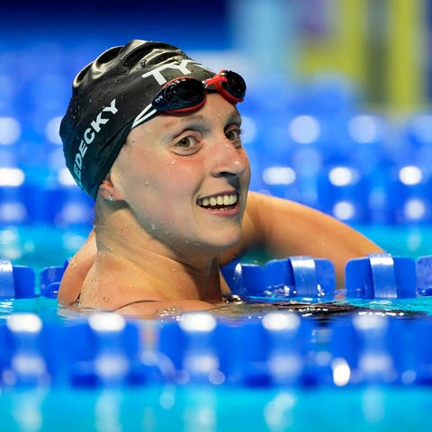 Katie Ledecky reacts after swimming in the Women's