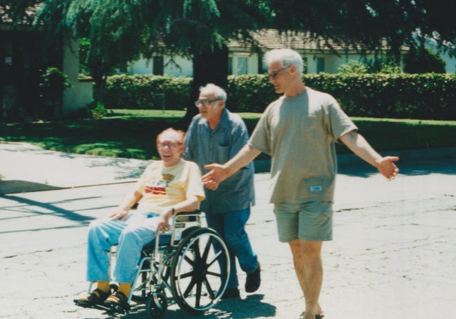 Lionel Friedman (in wheelchair), John Strauss and author Larry Strauss (right) in Los Angeles.