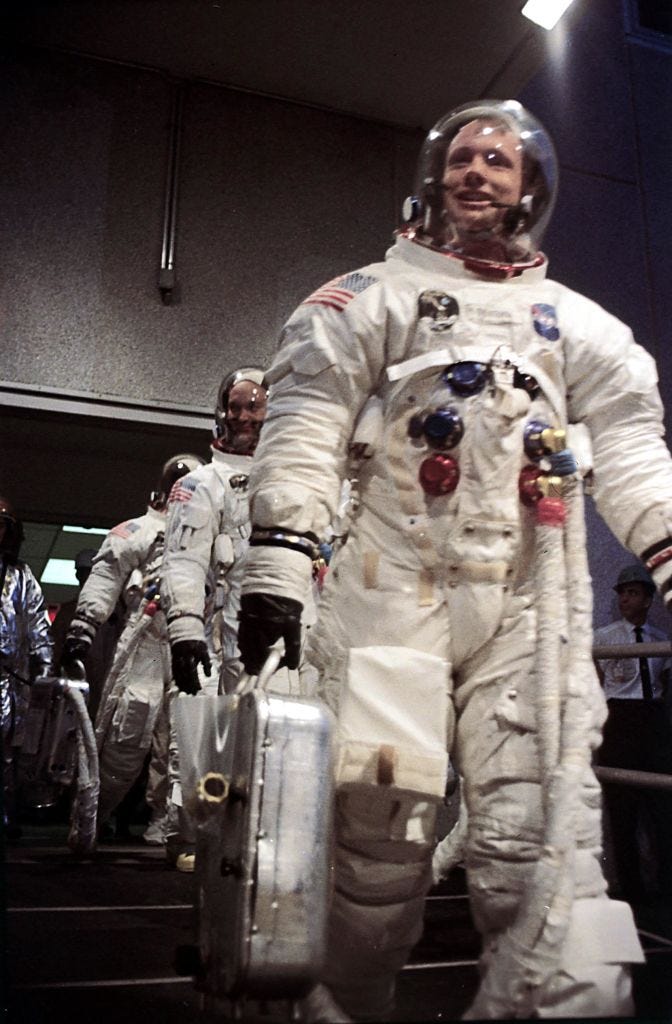 Picture dated 16 July 1969 of Apollo 11 commander Neil Armstrong, the first man on the Moon, at Kennedy Space Center in Houston with other crew members astronauts Michael Collins and Edwin Aldrin before their lunar mission. (Photo by STF / AFP)        (Photo credit should read STF/AFP via Getty Images)