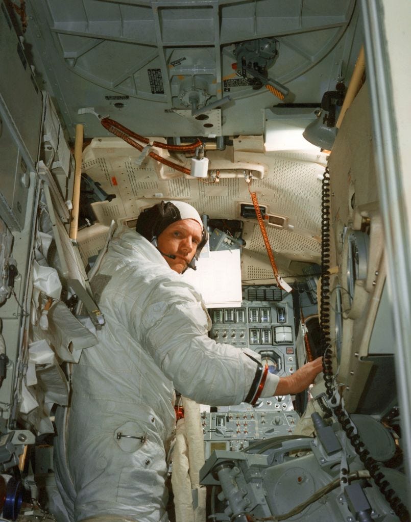 Neil A. Armstrong, commander for the Apollo XI Moon-landing mission, practicing in a lunar module simulator, Kennedy Space Center, July 1969.