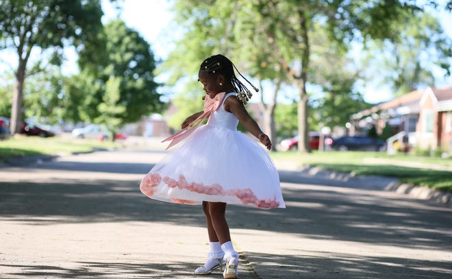 Robyn Rosie White, 6, of Redford Township has fun while being photographed on June 16, 2021. White was crowned Miss Juneteenth 2021 for her impersonations of historical Black women.