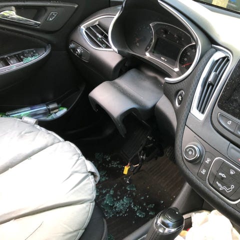 The interior of a Chevrolet Malibu after thieves s